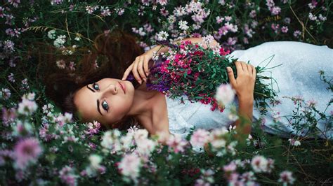 girl in flower field by sergey shatskov