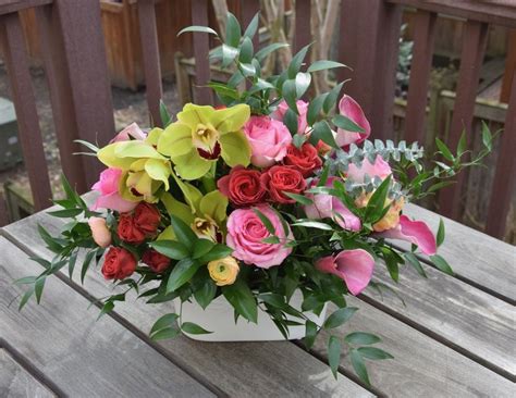 Flower Arrangement For A Party Cymbidium Orchids Roses