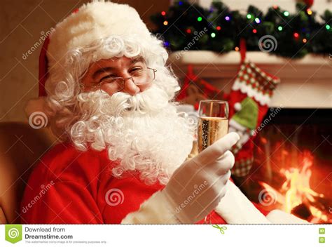 santa claus  glass  sparkling wine champagne   christmas tree stock image image