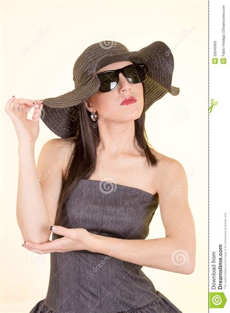 Fashion Woman Wearing Sunglasses And Hat Stock Image