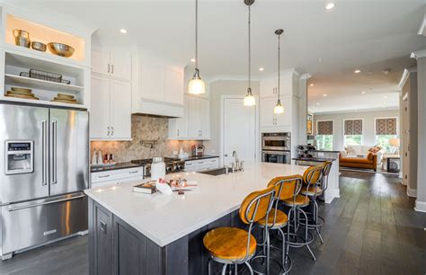 white kitchen  amped   notch  stainless steel  wooden accents pulte homes