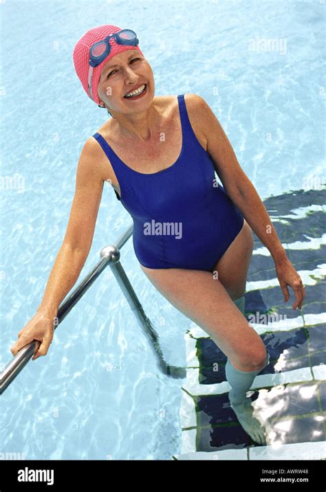 mature woman coming   swimming pool smiling stock photo alamy