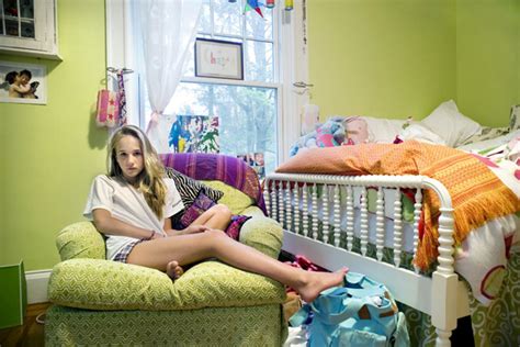 teenage girls in their bedrooms in photographs by rania matar