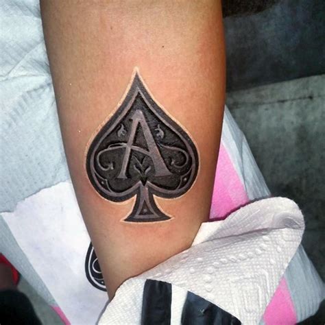 3d like beautiful spades symbol with lettering tattoo on arm