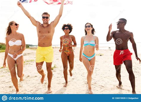 happy friends with american flag on summer beach stock image image of