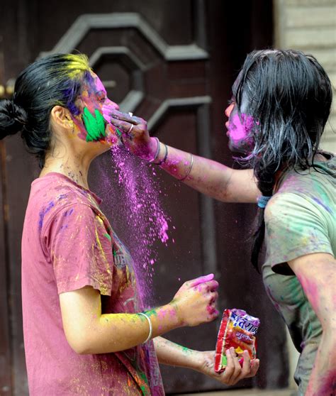 two girls got into the holi fun in new delhi india holi festival