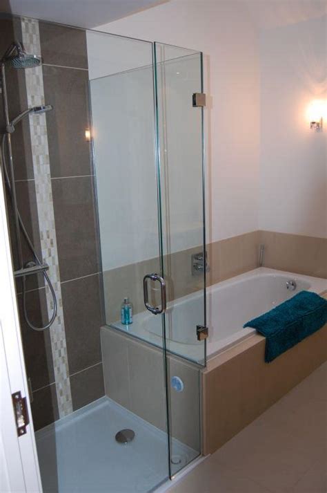 Shower Cubicle Flush Against End Of Bath With Glass Screen