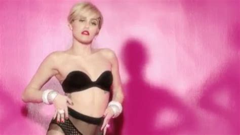 miley cyrus dances around in lingerie for racy italian commercial