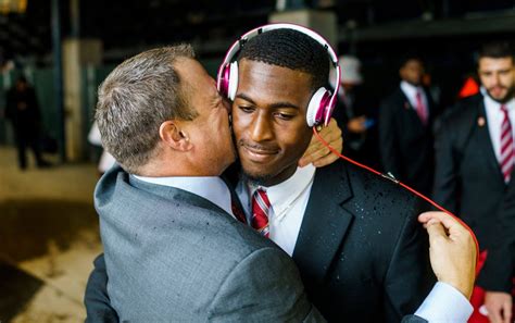 Houstons Coach Pecks Away At Footballs Macho Culture A Kiss At A
