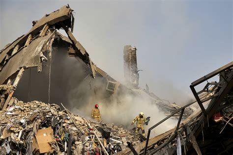iran plasco building collapse kills tehran firefighters battling intense fire cbs news