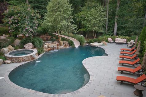 freeform oasis pool  lush landscaping clarksville md inground custom pool designer