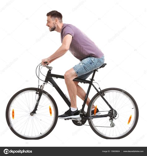 handsome young man riding bicycle  white background stock photo