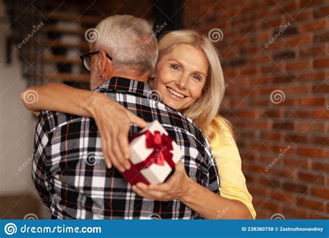 Romantic Older Couple Grandfather Or Senior Asian Husband Embracing