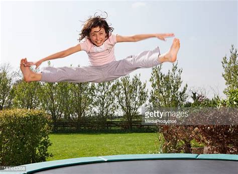 Teens Jumping On A Trampoline Photos Et Images De Collection Getty Images