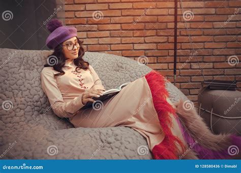 asian fashion woman reading book indoors stock photo image  female