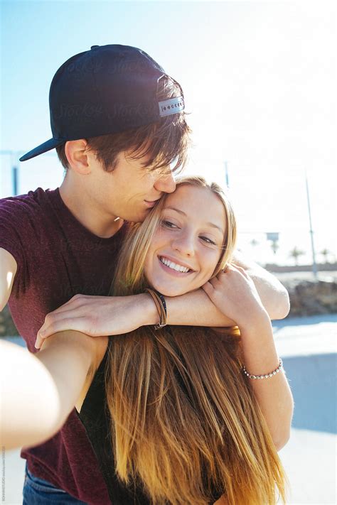 Teenage Couple In Love Making A Selfie In Summer By Stocksy