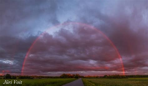 red rainbow at sunset over estonia today s image earthsky