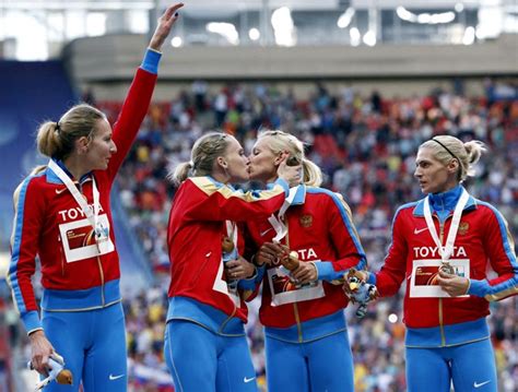 russia s golden girls protest anti gay law with podium kiss rediff sports