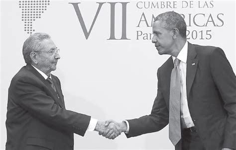 us president barack obama shakes hands with cuba s president raul castro as they hold a