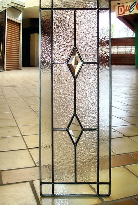 This Six Lite Grid Cabinet Glass Insert With A Textured Background And