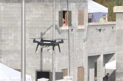 darpa deploys swarms  autonomous robots  carry  urban raid