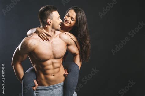 love and sex concept female hands touching muscular man isolated over