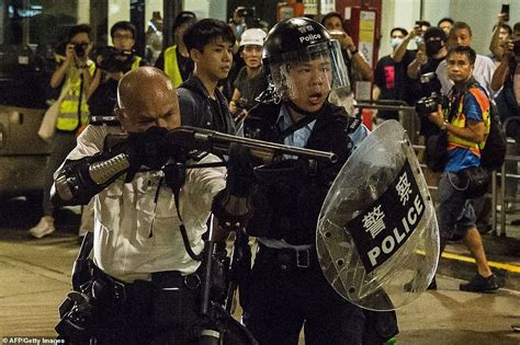 car shoots flaming fireworks at hundreds of hong kong protestors calling for arrested to be