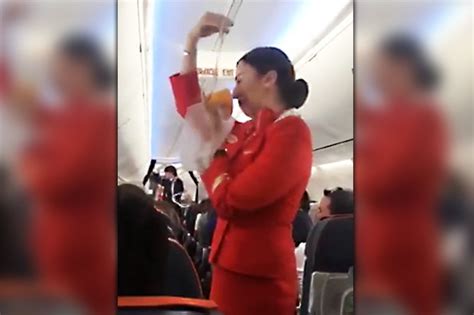 Air Hostess Interrupted During Safety Demonstration By