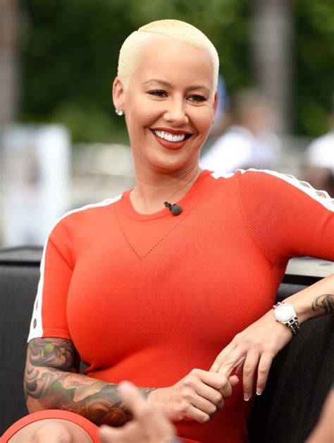 amber rose looks unrecognizable in brown wig blue contacts pics