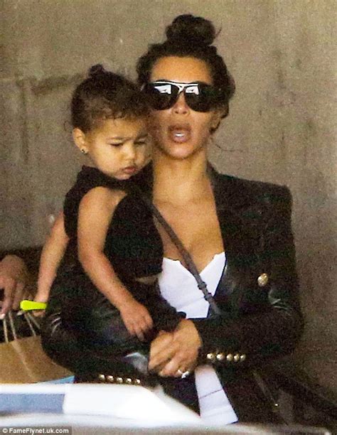 north west mimics kim kardashian s facial expression and stylish topknot daily mail online