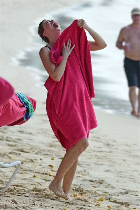rhea durham seen wearing a green swimsuit as she enjoys a beach day in