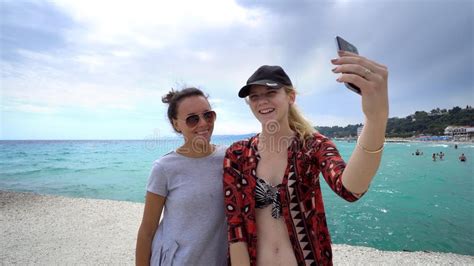 Funny Female Friends On Vacation Taking Selfies On The