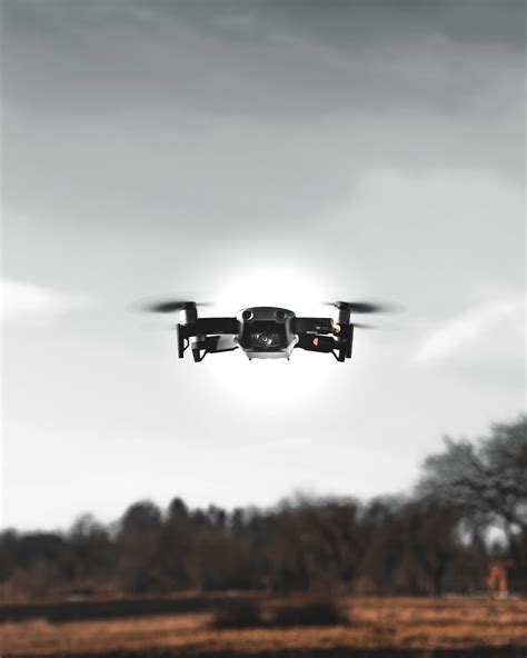 black drone  flight photo  white image  unsplash