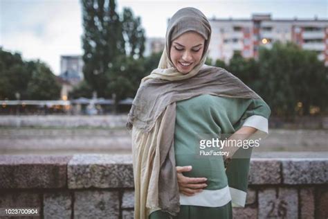 preganant woman with hijab photos and premium high res pictures getty