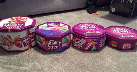 picture showing  quality street tins  slimmed   years  upset