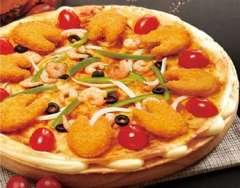 dominos chinas  pizza  topped  fish shaped fish sticks brand eating