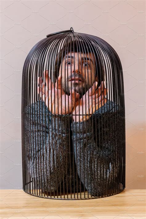 man locked in a cage high quality people images ~ creative market