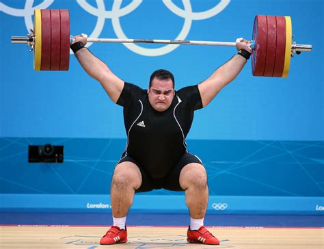iranian weight lifter wins gold in men s super heavyweight division