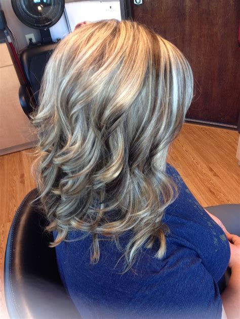 blonde highlights brown lowlights curls hair by melissa