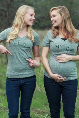 Two Pregnant Women Standing Next To Each Other