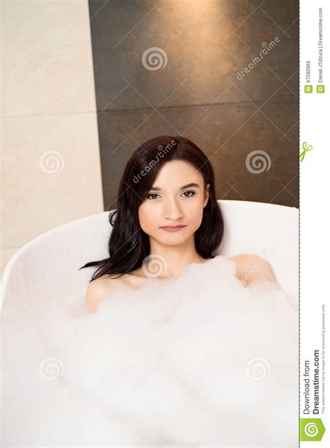 brunette woman relaxing in bath with foam stock image image of bath
