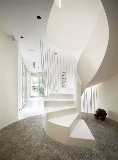 white shades define luxurious multistory milan apartment