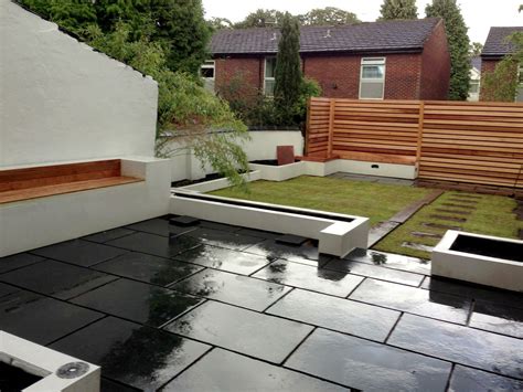 An Outdoor Area With Black And White Tiles On The Ground