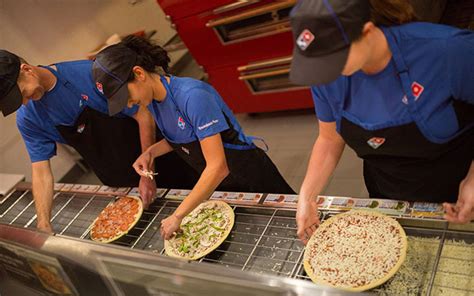 dominos  sales fall short  rival delivery services bite crains detroit business