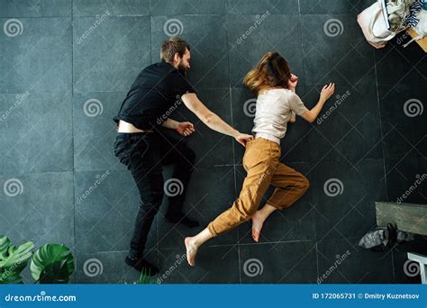 Man Grabs Woman By The Waist Band As A Part Of A Scene They Do On The