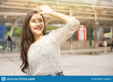 beautiful girl covering face  hand  sunlight stock photo image  people