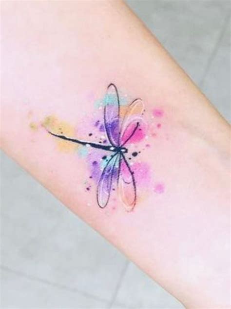A Watercolor Tattoo With A Dragonfly On Its Left Arm And Colorful Ink