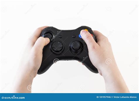 womans hands holding  controller  play video games stock photo