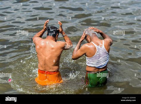 indian people   bath  ana sagar lake  ajmer india stock photo royalty  image