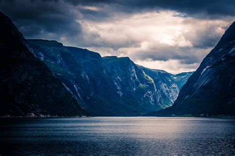 photo ocean  mountain ranges  sunset calm waters